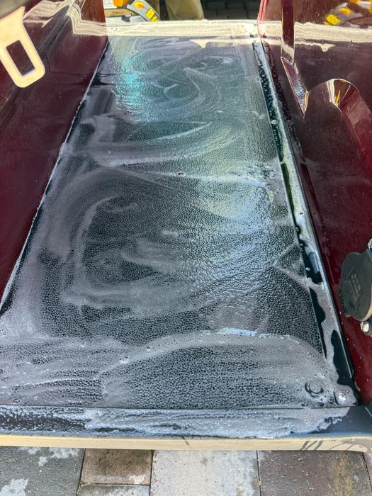 Custom golf cart glass being foamed and polished by Coco Detailers 702