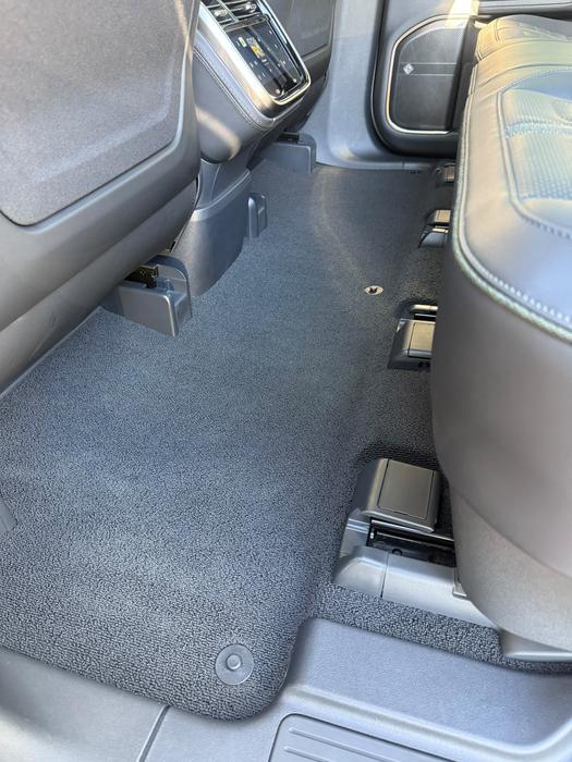 Rivian R1S rear footwell carpet after hot-water extraction