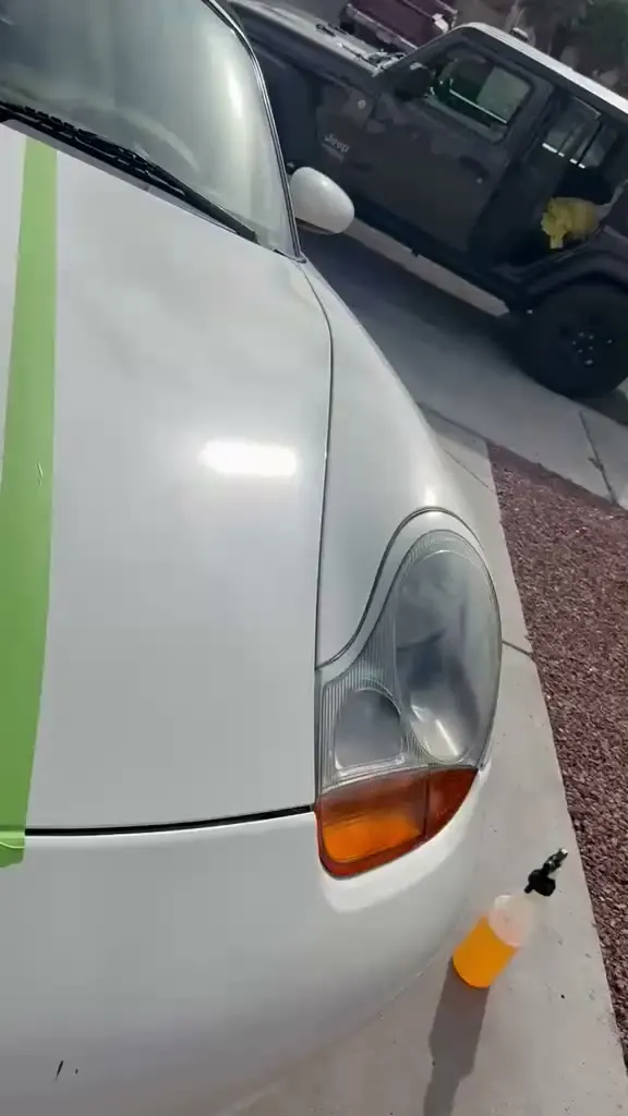 Ceramic coating being applied by hand in even panel sections
