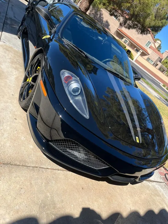 Black Ferrari F430 front three-quarter after a full detail