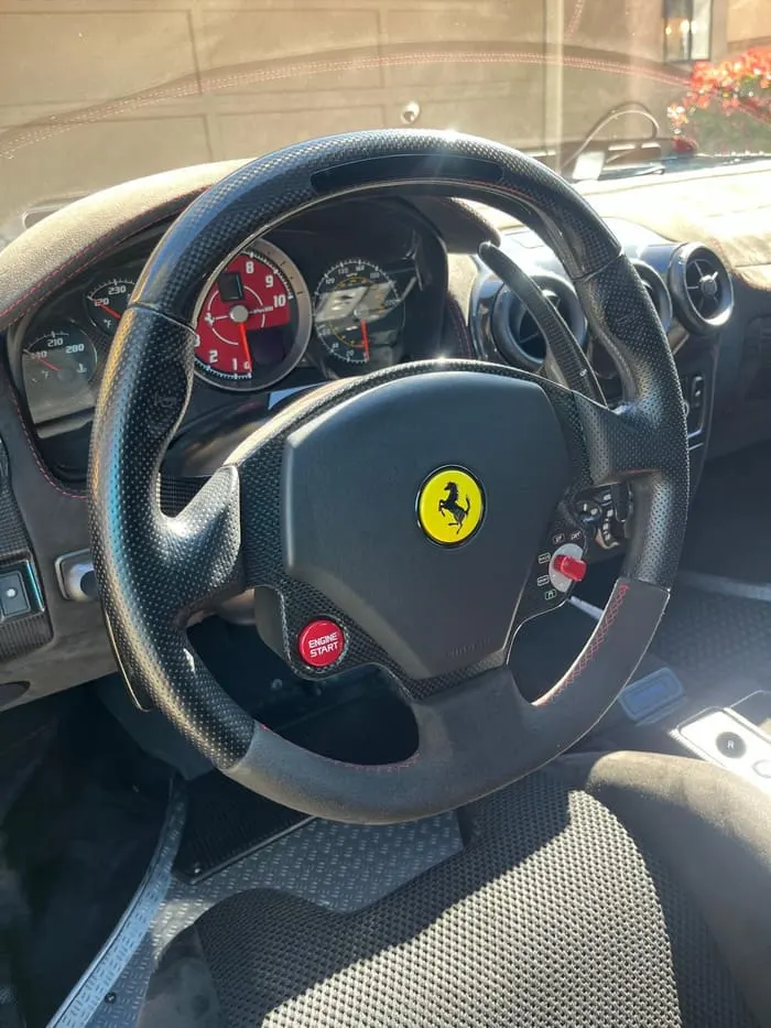 Ferrari F430 steering wheel and dash after an interior detail