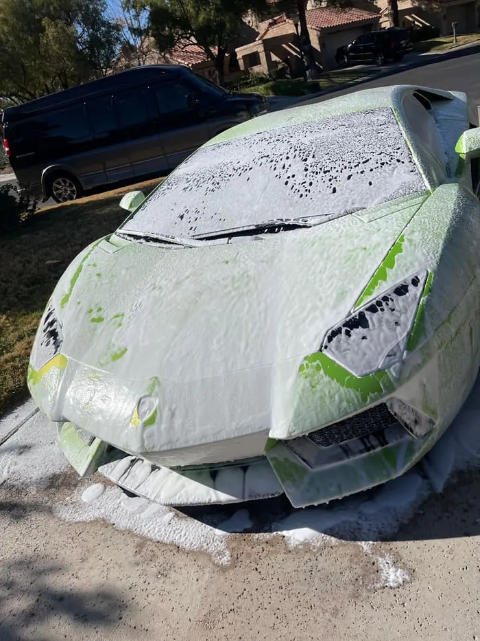 Lamborghini Aventador covered in snow foam during a hand wash