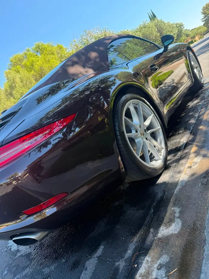 Porsche 911 Cabriolet side profile with polished wheel and cleaned exhaust tips
