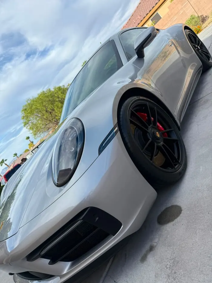 Porsche 911 Turbo S front end with polished paint and freshly cleaned wheel